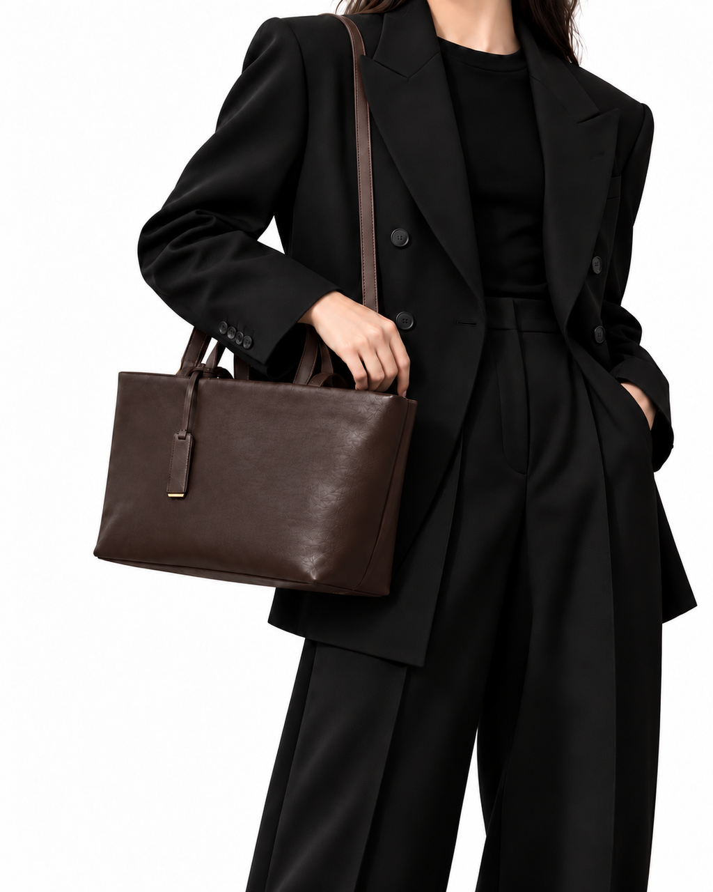 The Palazzo Tote in Tobacco, worn with a black suit