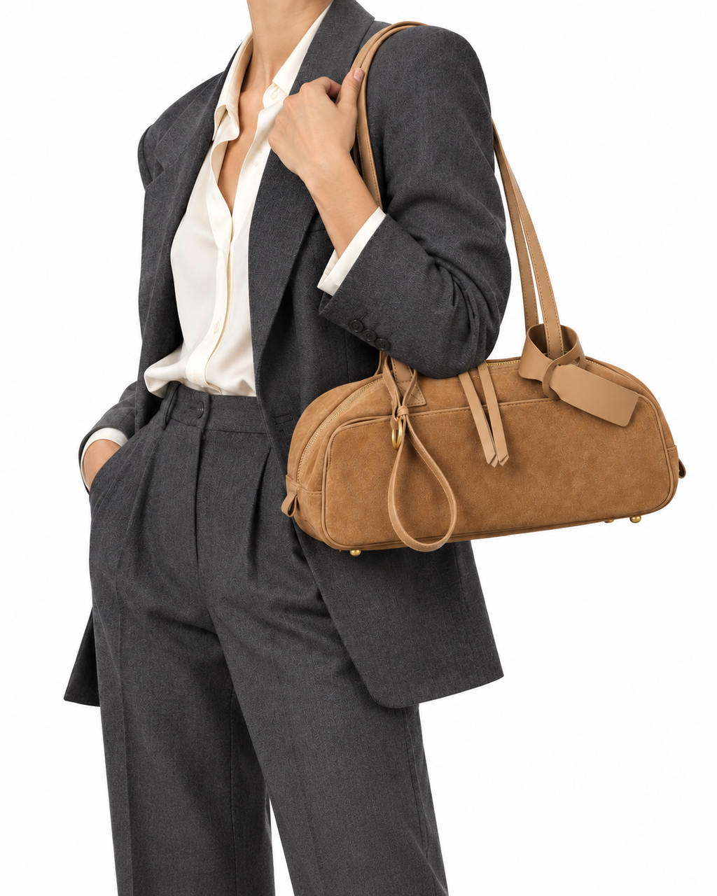 The Livia Shoulder Bag in Caramel, worn with a grey suit